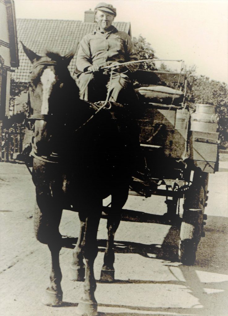 D.J. Zwezerijn op de bok van paard en wagen